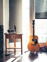 Musician with headphones in studio
